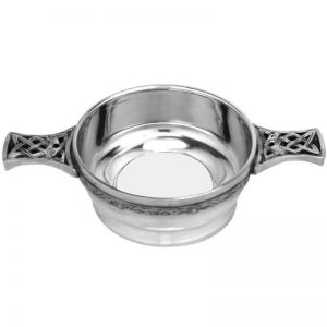 Pewter quaich with pierced celtic handles and glass bottom